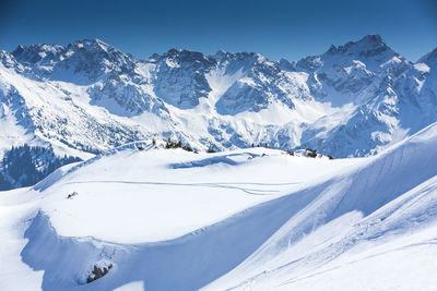 Scenic view of snow covered mountains