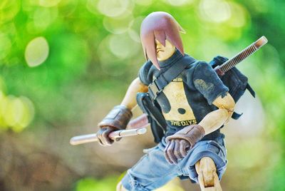 Full length of man riding toy car