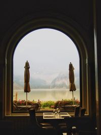 Panoramic shot of table by window against sky