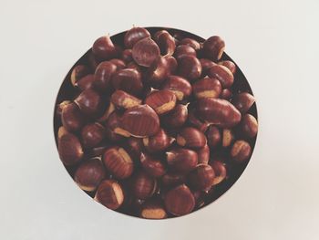 Directly above shot of coffee beans against white background