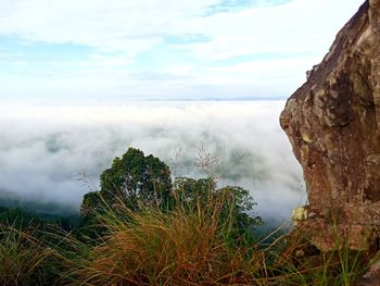 Scenic view of waterfall against sky