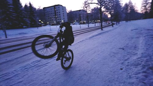 People riding bicycle on road