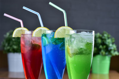 Close-up of multi colored drink in glasses