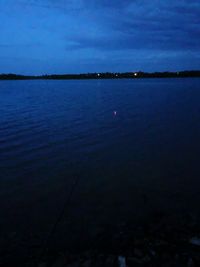 Scenic view of sea against sky at night