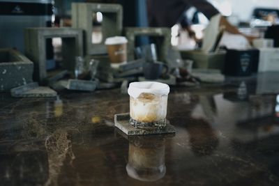 Close-up of coffee in glass on table at cafe