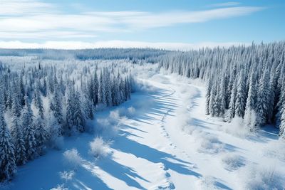 Snow covered landscape against sky