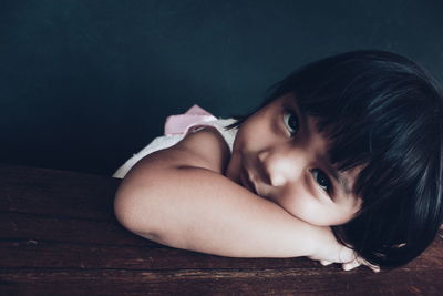 Portrait of cute girl lying down