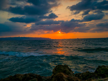 Scenic view of sea against sky during sunset