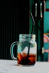 Close-up of drink in jar on table