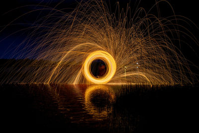 Light painting against sky at night