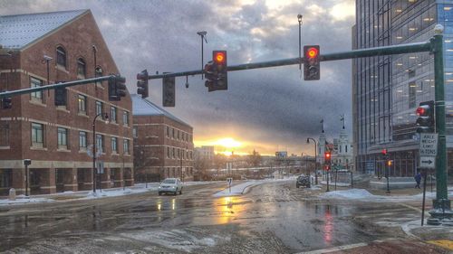 Road in city against cloudy sky