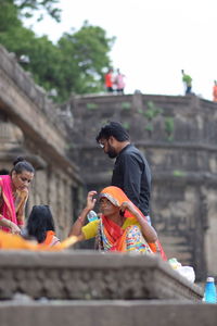 People looking at built structure