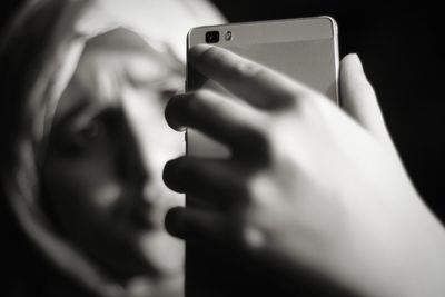Close-up portrait of man using mobile phone