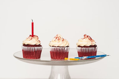 Close-up of cupcakes against white background