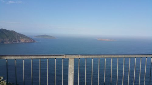 Scenic view of sea against clear blue sky