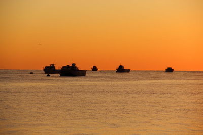 Scenic view of sea against clear sky during sunset