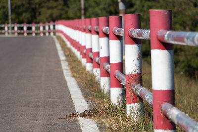 Close-up of railing by road