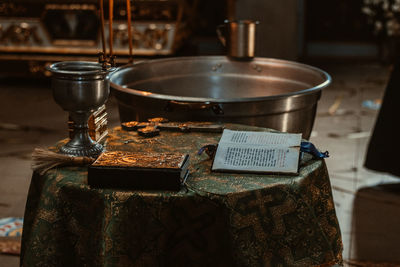 Close-up of old tea cup on table