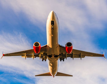 Low angle view of airplane against sky