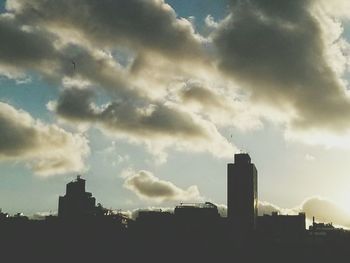 Low angle view of building against cloudy sky