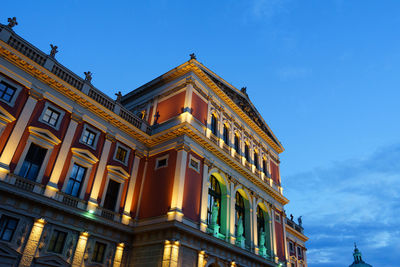 Low angle view of building against blue sky