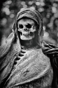 Close-up of angel statue in cemetery