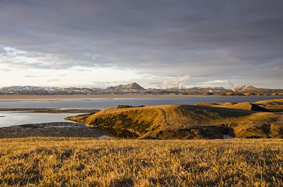 The pseudocraters and the lake beyond during the golden hour before sunset