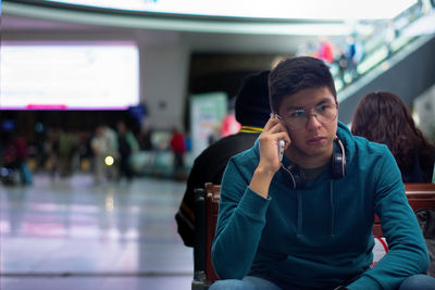 Side view of young man looking away