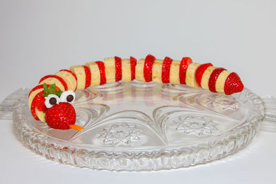 High angle view of candies on table against white background