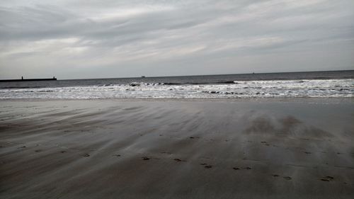 Scenic view of beach against sky