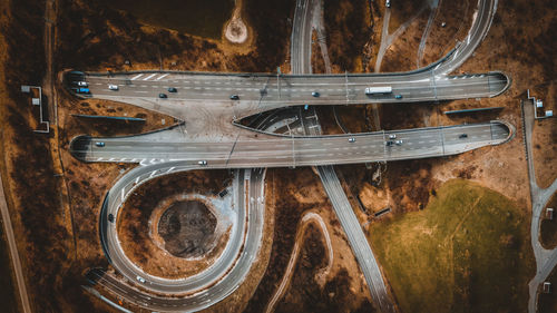 A swiss highway on a bridge between two tunnels with an exit