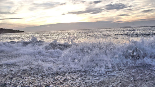 Scenic view of sea against cloudy sky