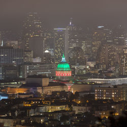 Illuminated buildings in city at night