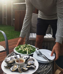 Midsection of man preparing food