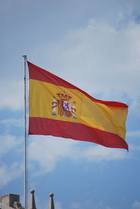 Low angle view of flag against sky