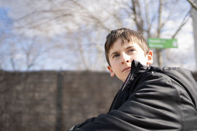 Portrait of handsome young boy relaxed and looking with confidence. copy space