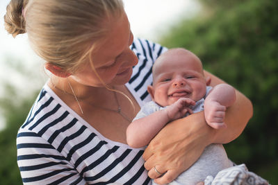 Close-up of mother holding baby