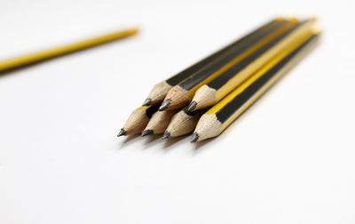 High angle view of pencils on white background