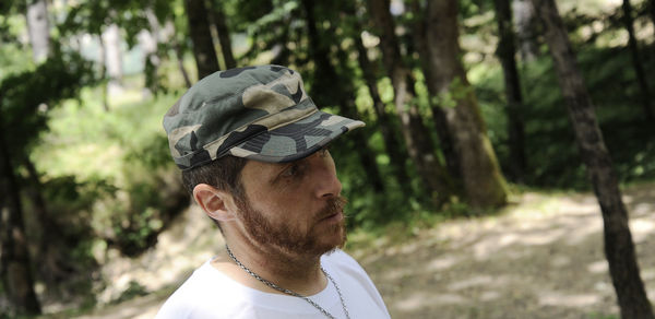 Portrait of young man in forest