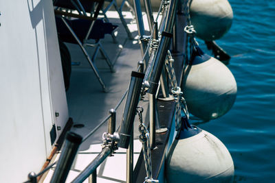 Close-up of sailboats moored in sea