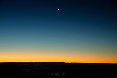 Scenic view of silhouette landscape against clear sky at sunset