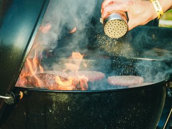 Meat cooking on barbecue grill