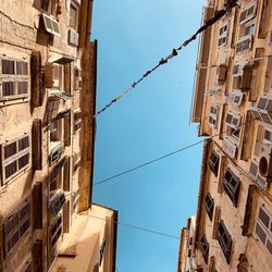 Low angle view of buildings against clear sky