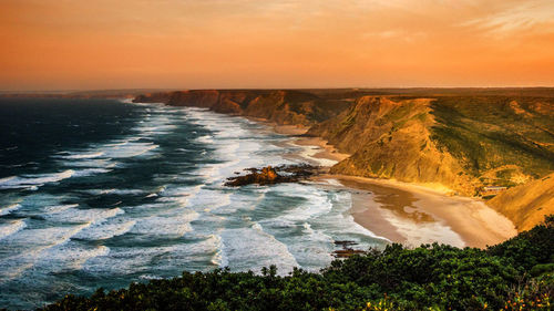 Scenic view of sea against sky during sunset