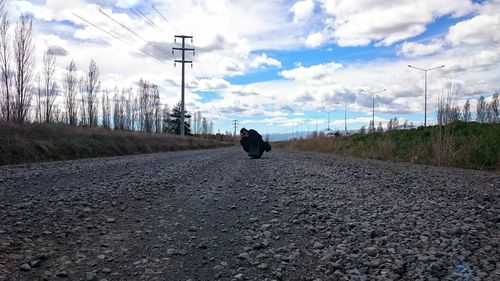 View of road against cloudy sky