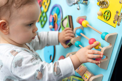 Close-up of boy playing with toy