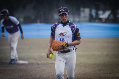 Full length of man standing on field