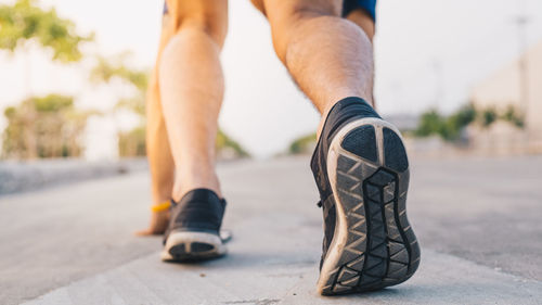 Low section of man legs on street