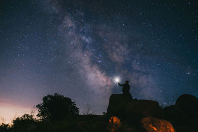 Low angle view of star field against sky