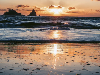 Scenic view of sea against sky during sunset